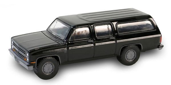 GREEN28150-D - CHEVROLET Suburban C10 custom deluxe 1985 zwart uit de BLACK BANDIT serie in blisterverpakking - 1