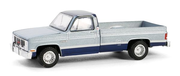 GREEN48090-D - GMC Sierra Classic K2500 1985 blauw DOWN ON THE FARM 09 serie in blisterverpakking - 1