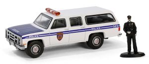 GREEN97160-D - GMC Suburban 2500 1985 Politie met beeldje uit DE HOBBY SHOP serie in blisterverpakking